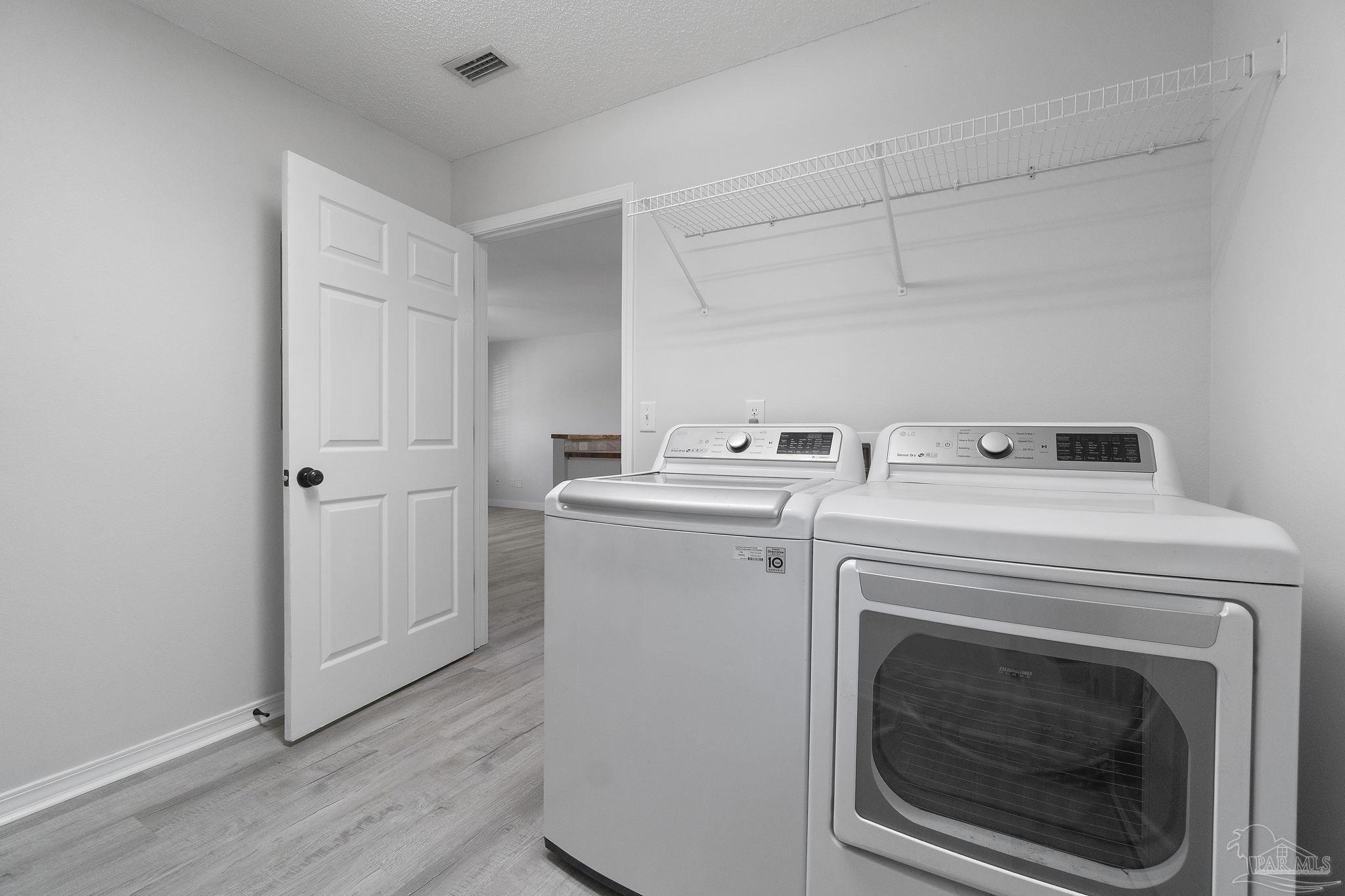 7253 Pro Lane Milton, FL 32570 - Photo 27 of 33 a utility room with dryer and washer