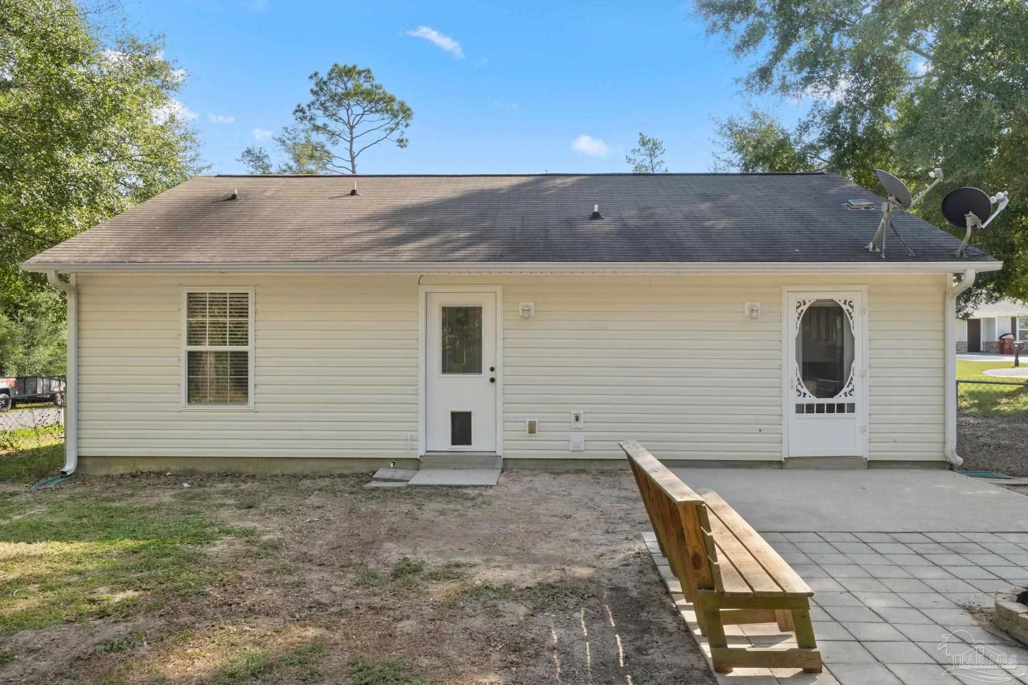 7253 Pro Lane Milton, FL 32570 - Photo 28 of 33 a view of a house with backyard