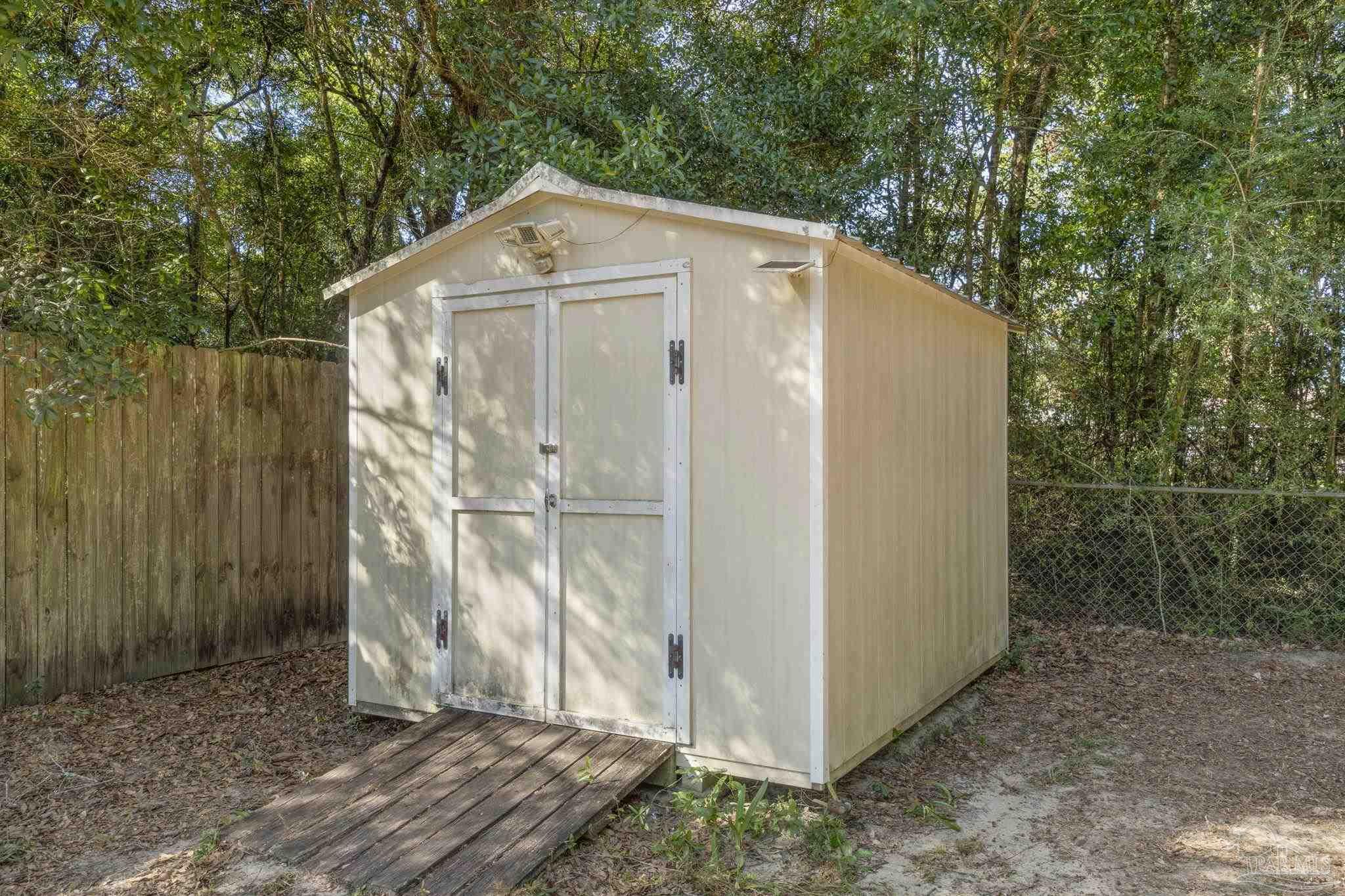 7253 Pro Lane Milton, FL 32570 - Photo 30 of 33 a side view of a house with a yard