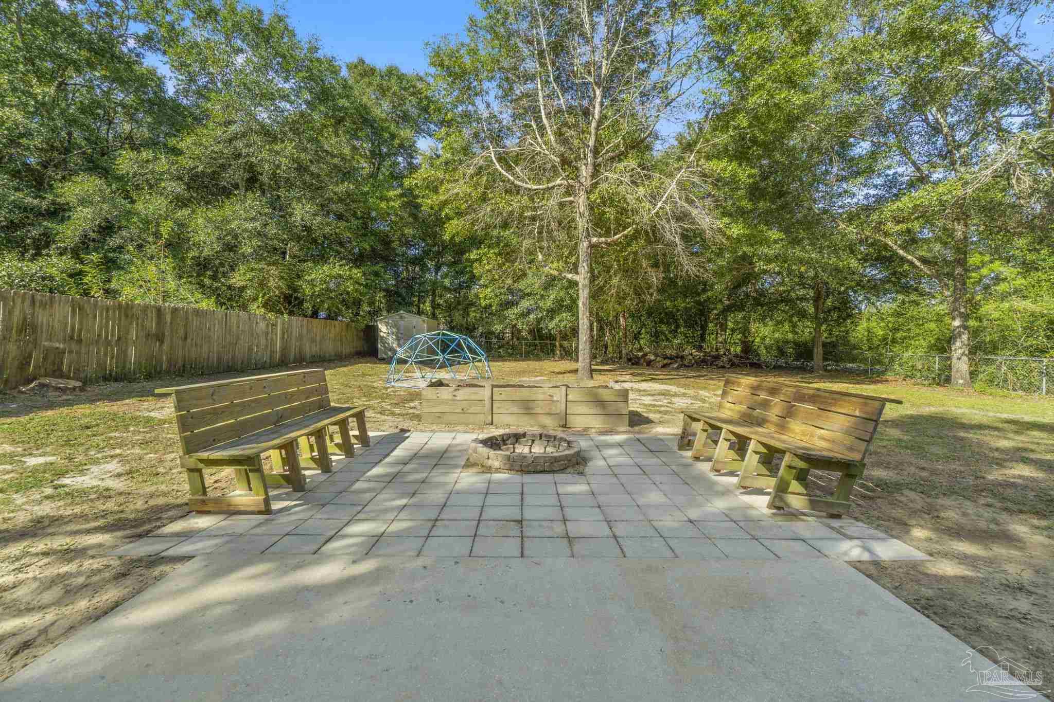 7253 Pro Lane Milton, FL 32570 - Photo 31 of 33 a view of a swimming pool with a patio and a yard