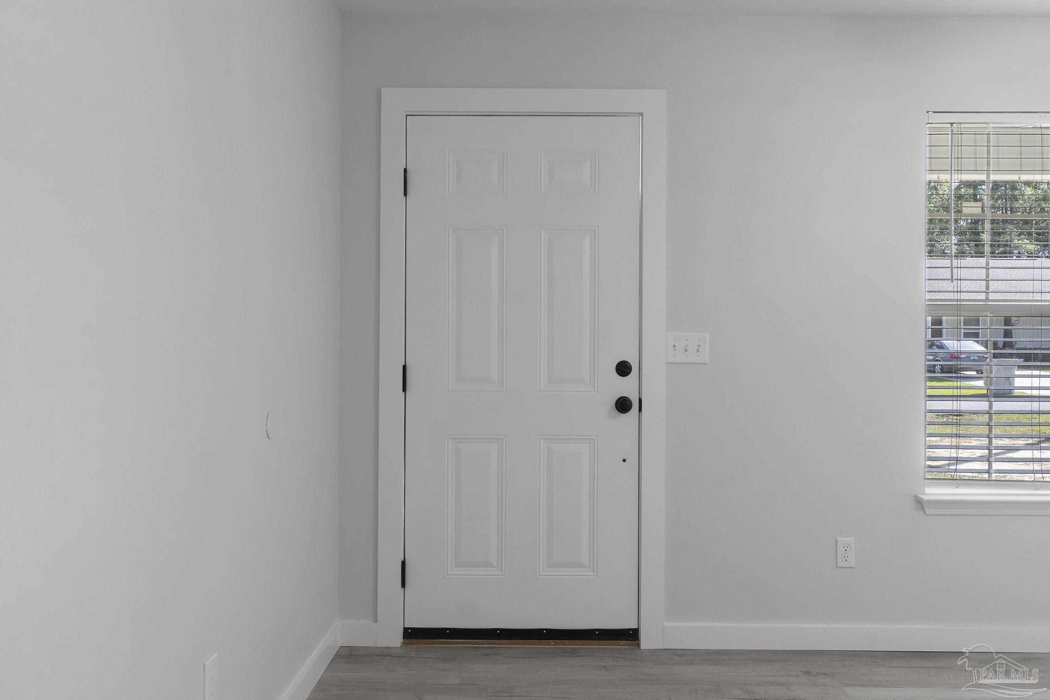 7253 Pro Lane Milton, FL 32570 - Photo 5 of 33 a view of an front door