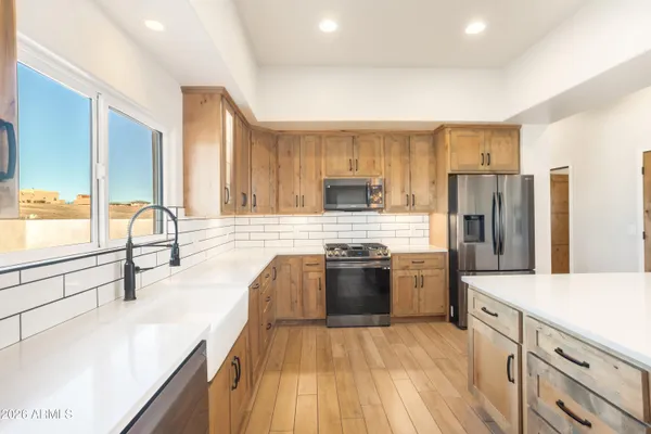 a bathroom with a sink and a large mirror