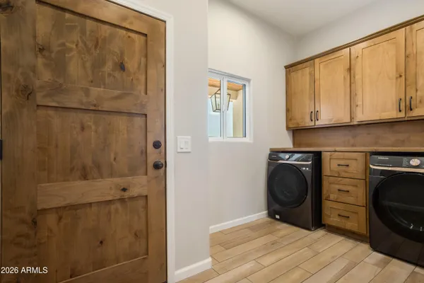 an empty room with a hardwood and ceiling fan