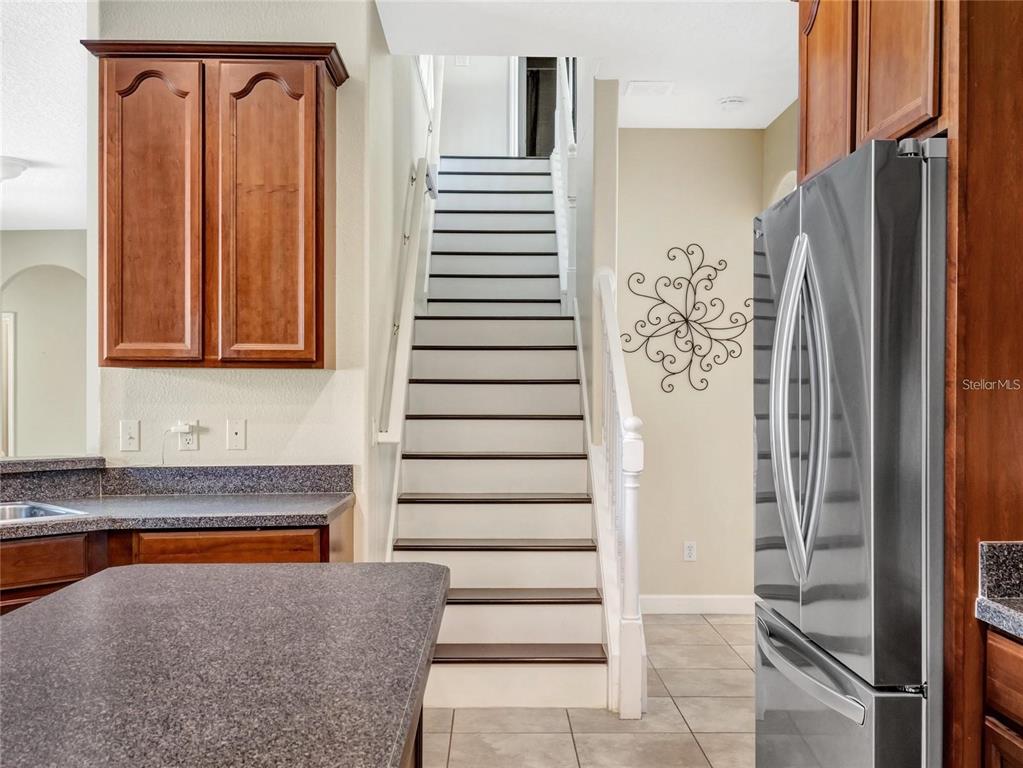 10023 Ians Ridge Road Orlando, FL 32832 - Photo 20 of 60 a view of front door with stairs