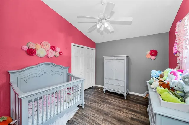 a bedroom with a large bed and a dresser