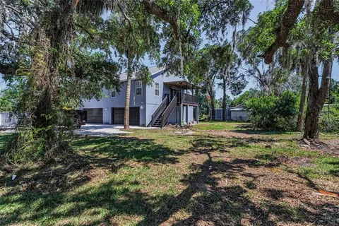 a view of a swimming pool with a outdoor seating