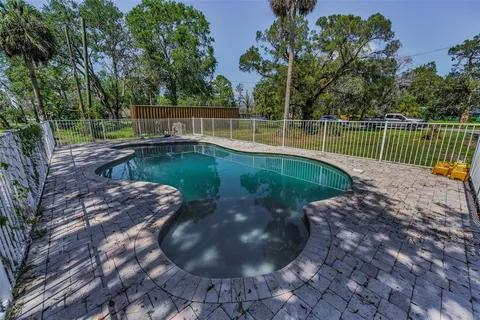 a view of a swimming pool with a garden