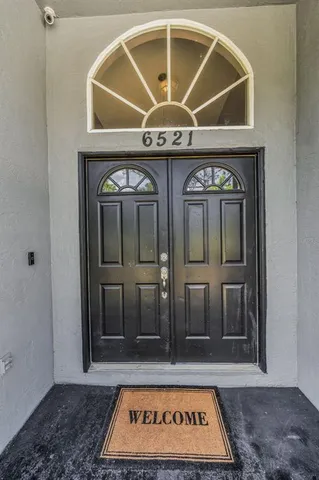 a kitchen with counter top space and wooden floor