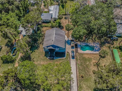 an aerial view of residential house with outdoor space