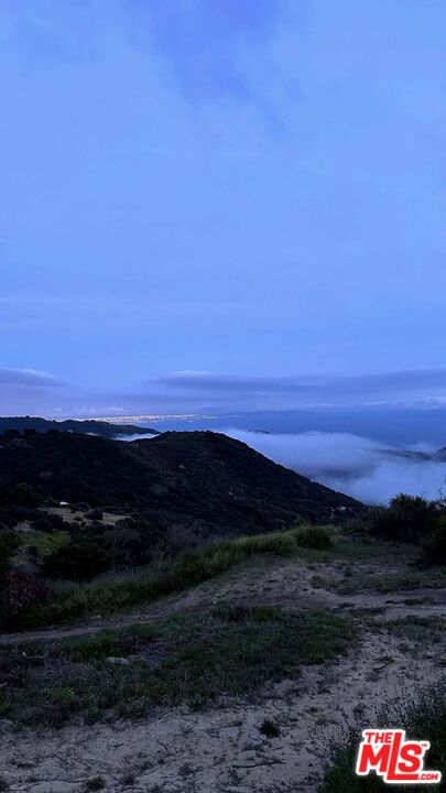 2195 Little Las Flores Road Topanga, CA 90290 - Photo 21 of 32 a view of an ocean and a mountain