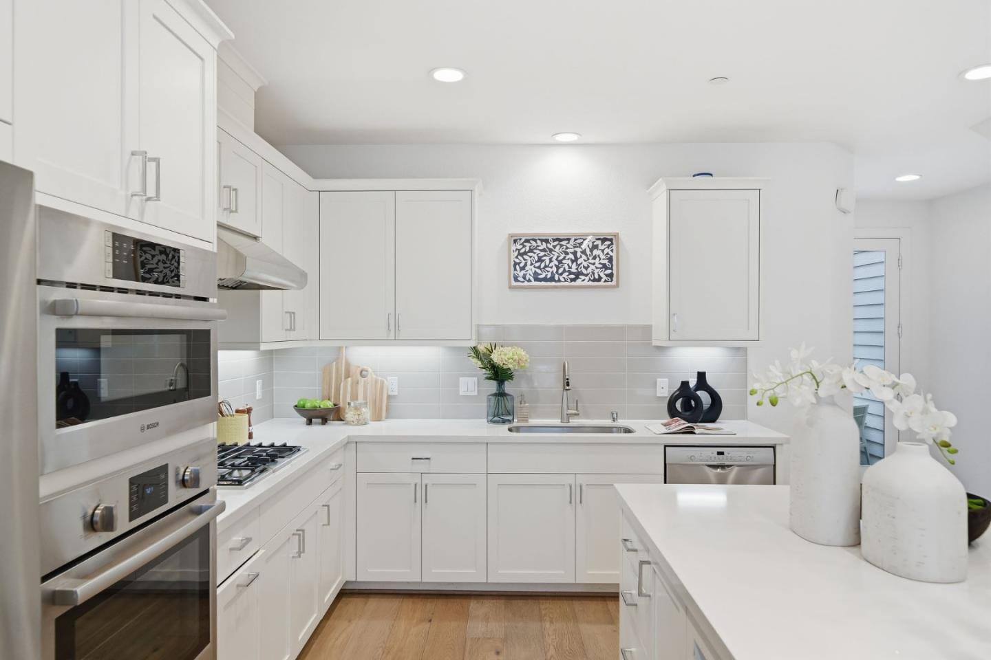 39124 Memorial Street Fremont, CA 94538 - Photo 20 of 40 a kitchen with a sink stove and cabinets