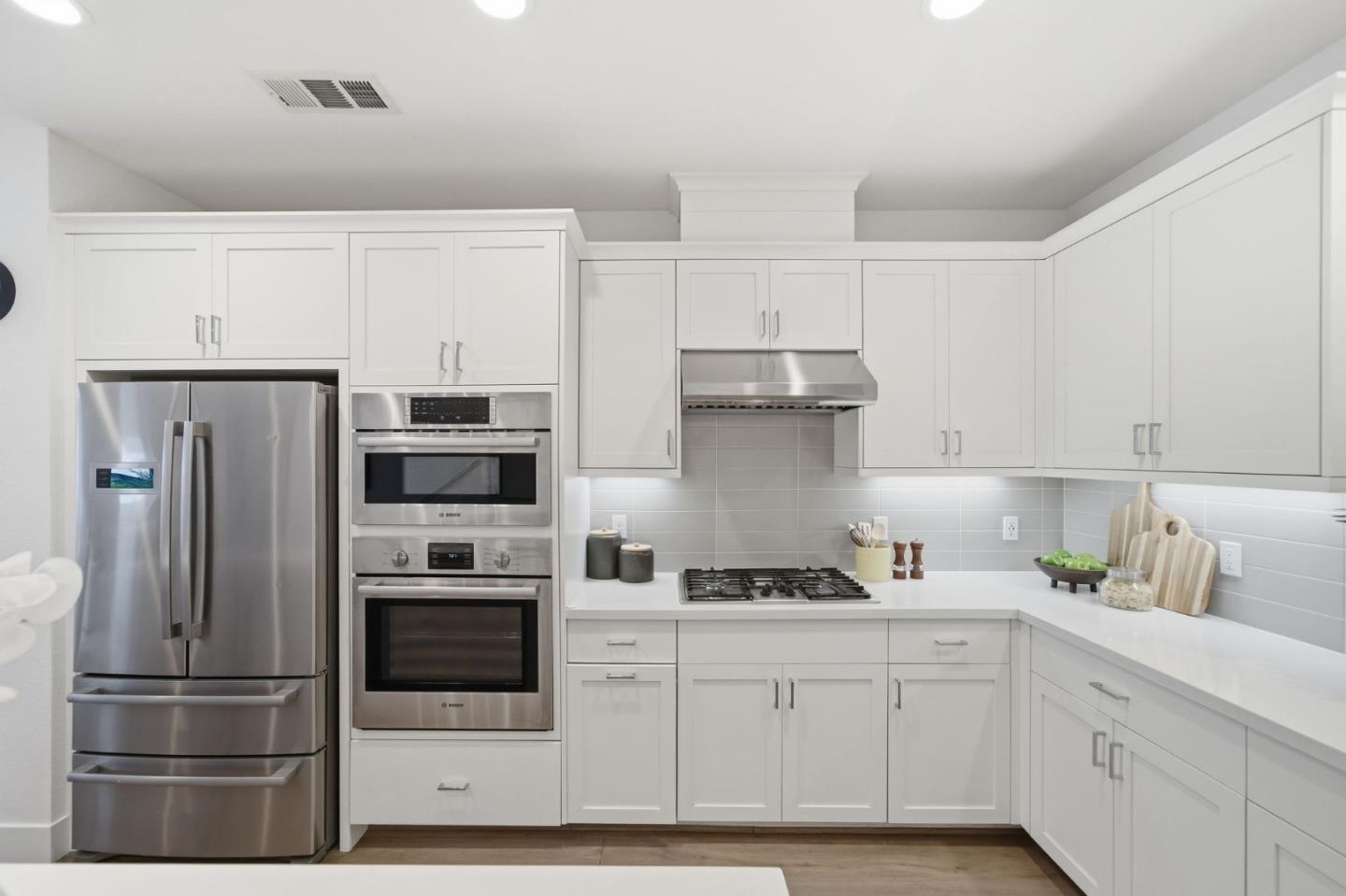 39124 Memorial Street Fremont, CA 94538 - Photo 21 of 40 a kitchen with stainless steel appliances a refrigerator sink and cabinets