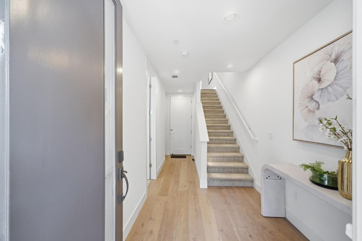 39124 Memorial Street Fremont, CA 94538 - Photo 8 of 40 a view of a hallway with stairs and wooden floor