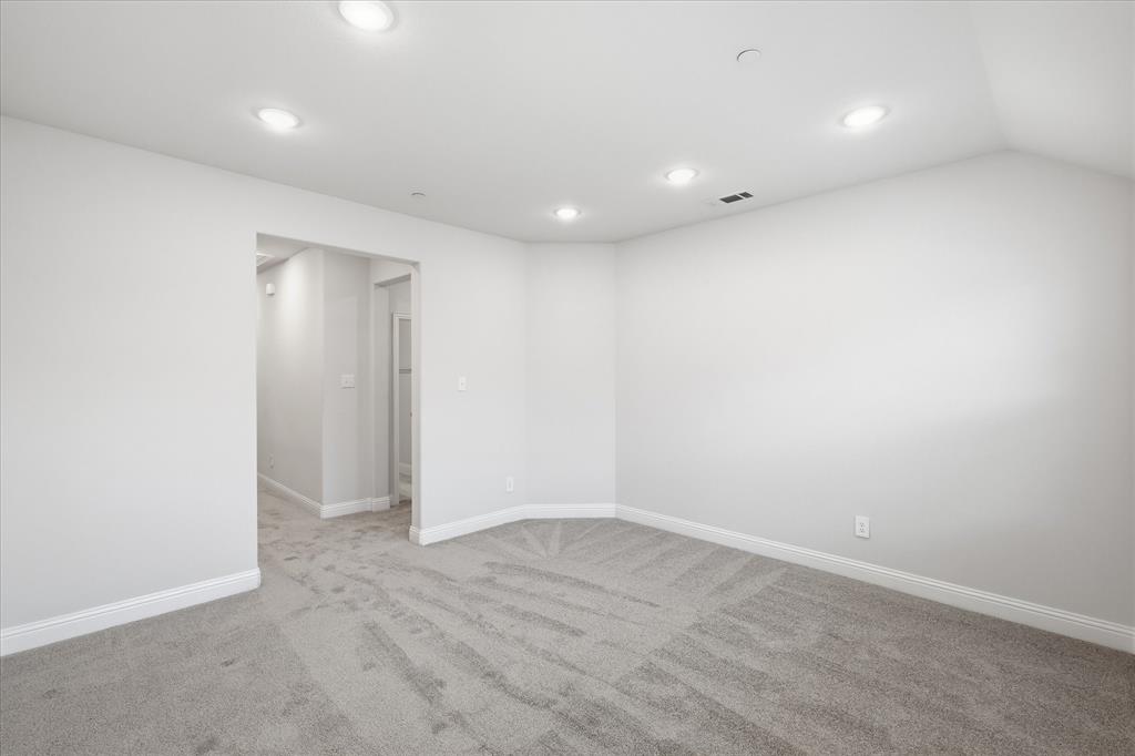 519 Sequoia Street Allen, TX 75002 - Photo 20 of 38 Spacious room featuring neutral grey carpeting, recessed ceiling lighting, and a wide entryway