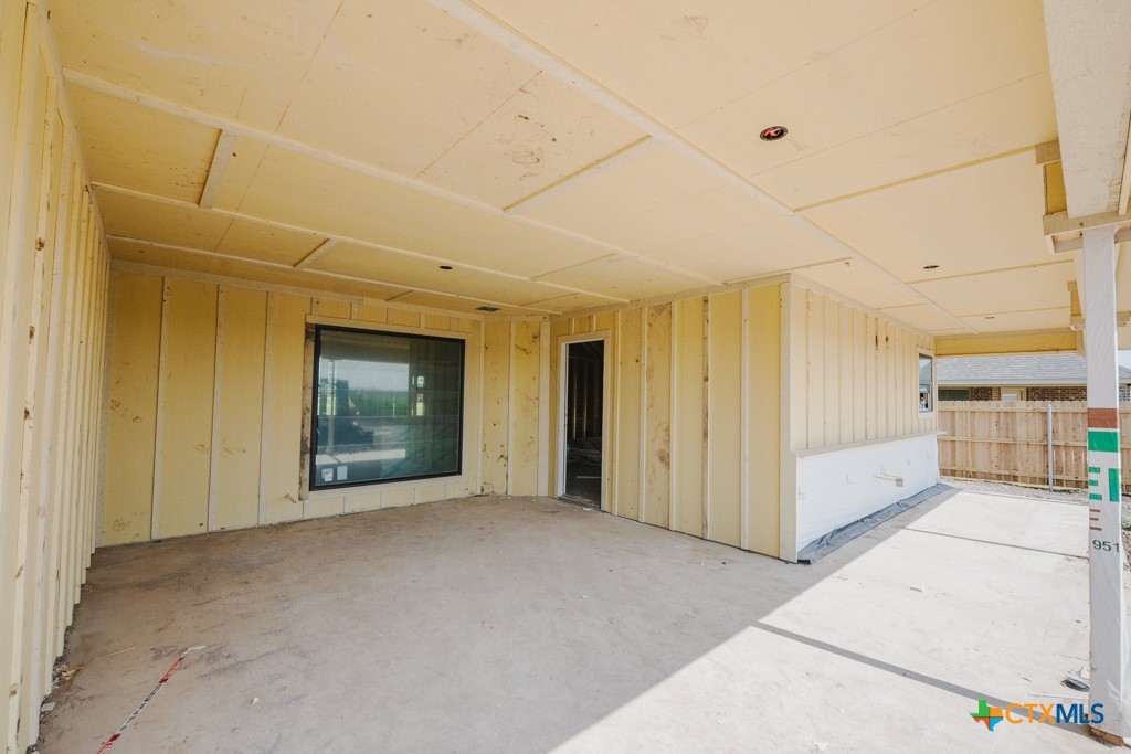 1313 Red Rock Road Lorena, TX 76655 - Photo 11 of 13 a view of a hallway with an empty room and a window