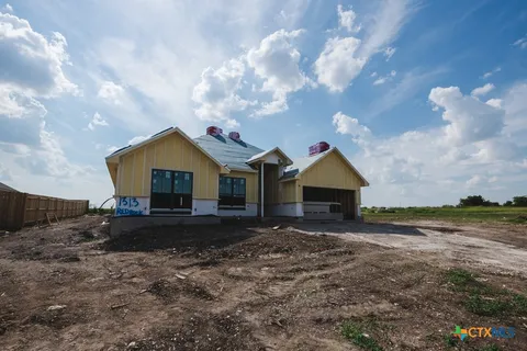 a front view of house with yard and entertaining space