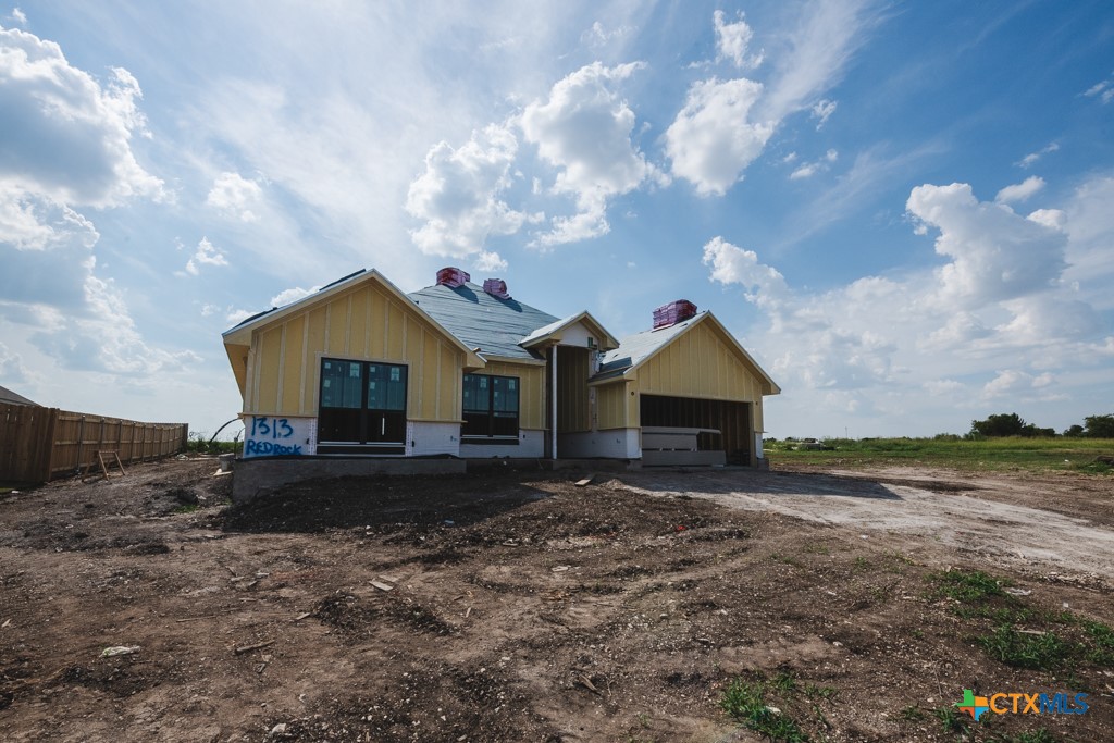 1313 Red Rock Road Lorena, TX 76655 - Photo 2 of 13 a front view of house with yard and entertaining space