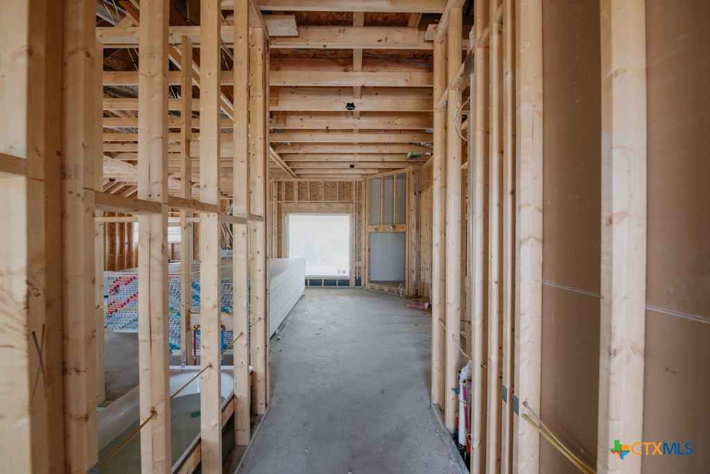 1313 Red Rock Road Lorena, TX 76655 - Photo 3 of 13 a view of a hallway with wooden shelves