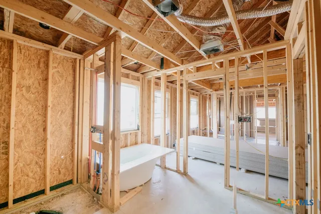 a view of a room with a floor to ceiling window