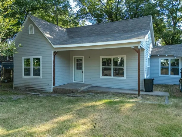 a view of house with backyard space and garden
