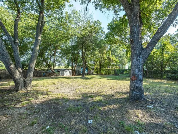 a backyard of a house with trees