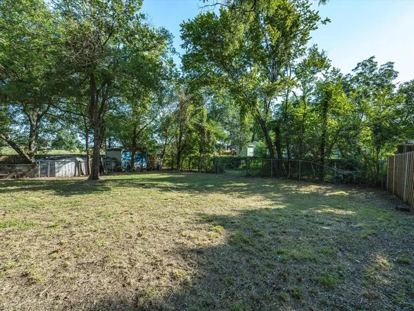 a view of house with yard