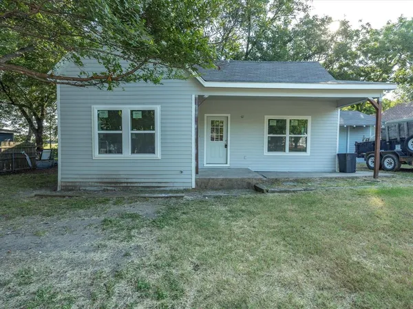 front view of a house with a yard