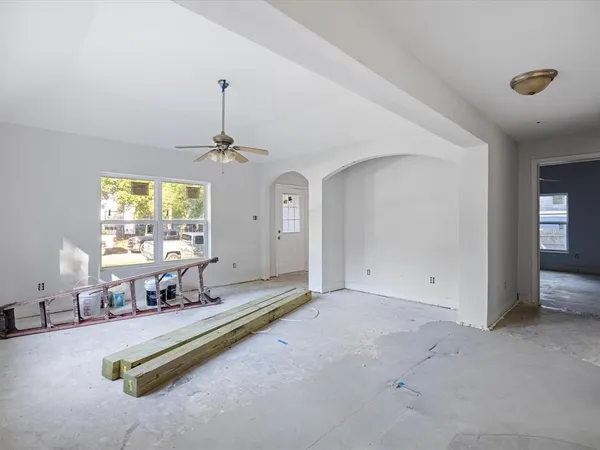 a living room with furniture pool table and a window