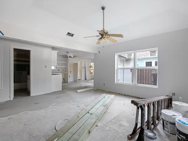 a view of a storage & utility room with closet dryer and washer