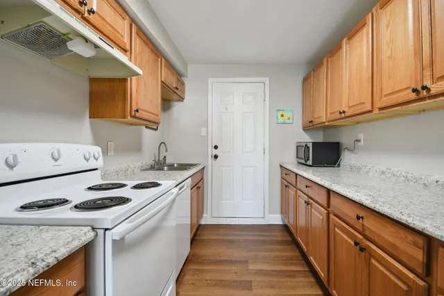 a kitchen with a stove and a sink