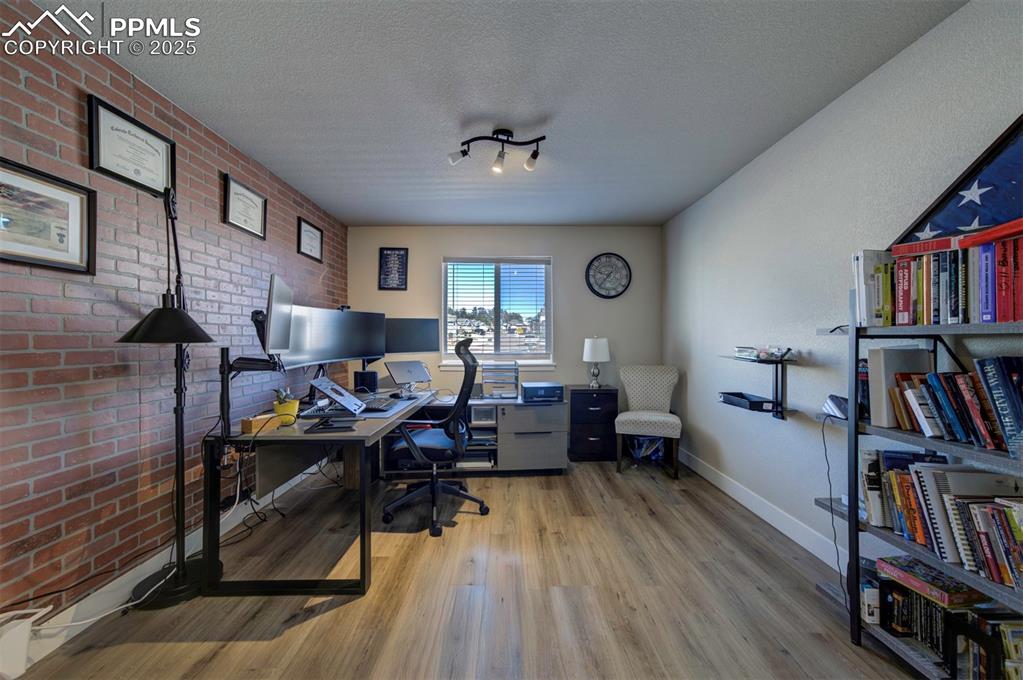 5489 Makalu Drive Colorado Springs, CO 80924 - Photo 13 of 47 a living room with furniture and a book shelf