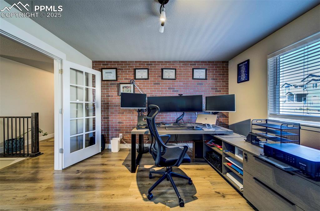 5489 Makalu Drive Colorado Springs, CO 80924 - Photo 14 of 47 a view of a workspace with furniture and a window