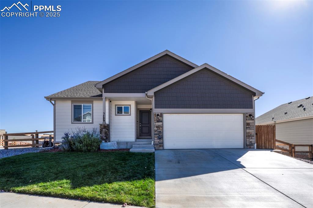 5489 Makalu Drive Colorado Springs, CO 80924 - Photo 2 of 47 a front view of house with yard