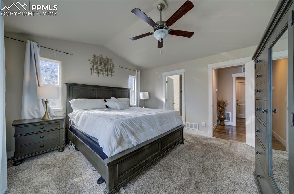 5489 Makalu Drive Colorado Springs, CO 80924 - Photo 27 of 47 a bedroom with a bed and a cabinets