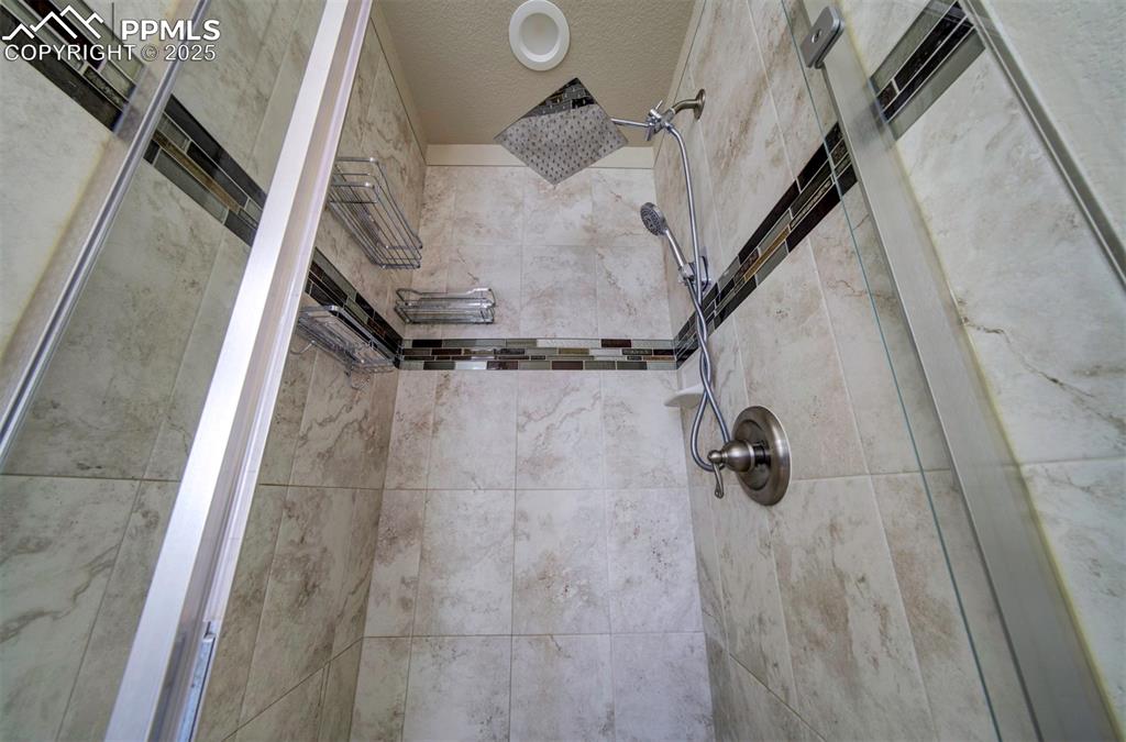 5489 Makalu Drive Colorado Springs, CO 80924 - Photo 32 of 47 a view of walk in closet