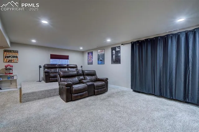 a living room with furniture and a cabinet