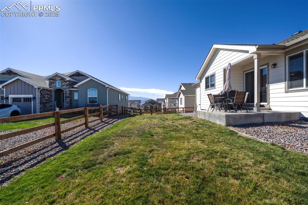 5489 Makalu Drive Colorado Springs, CO 80924 - Photo 4 of 47 a view of house with a yard and balcony