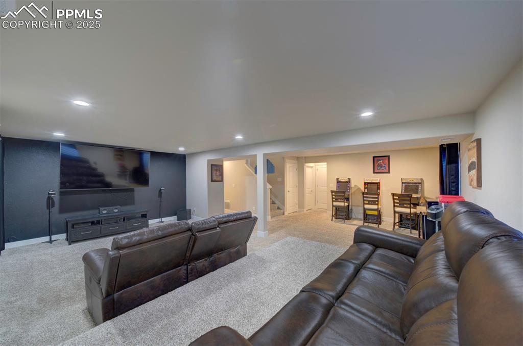 5489 Makalu Drive Colorado Springs, CO 80924 - Photo 43 of 47 a living room with furniture and a flat screen tv