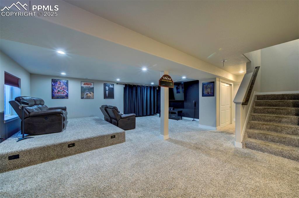 5489 Makalu Drive Colorado Springs, CO 80924 - Photo 44 of 47 a living room with furniture and a flat screen tv