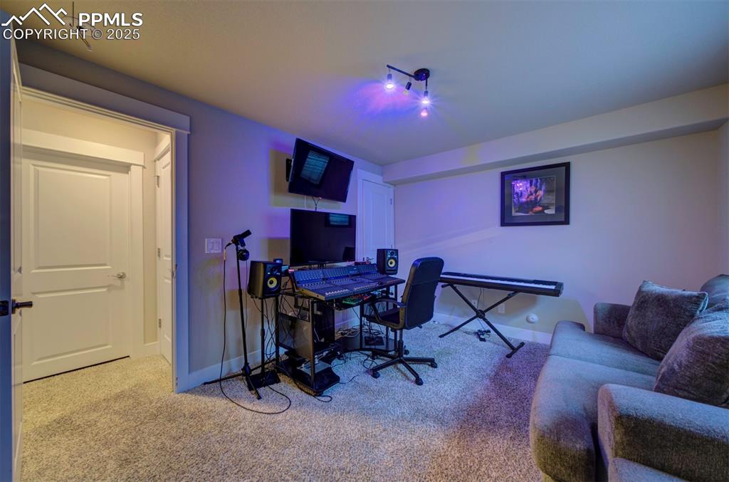 5489 Makalu Drive Colorado Springs, CO 80924 - Photo 47 of 47 a view of a livingroom with workspace and a couch