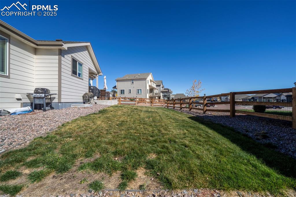 5489 Makalu Drive Colorado Springs, CO 80924 - Photo 5 of 47 a view of a backyard with sitting area