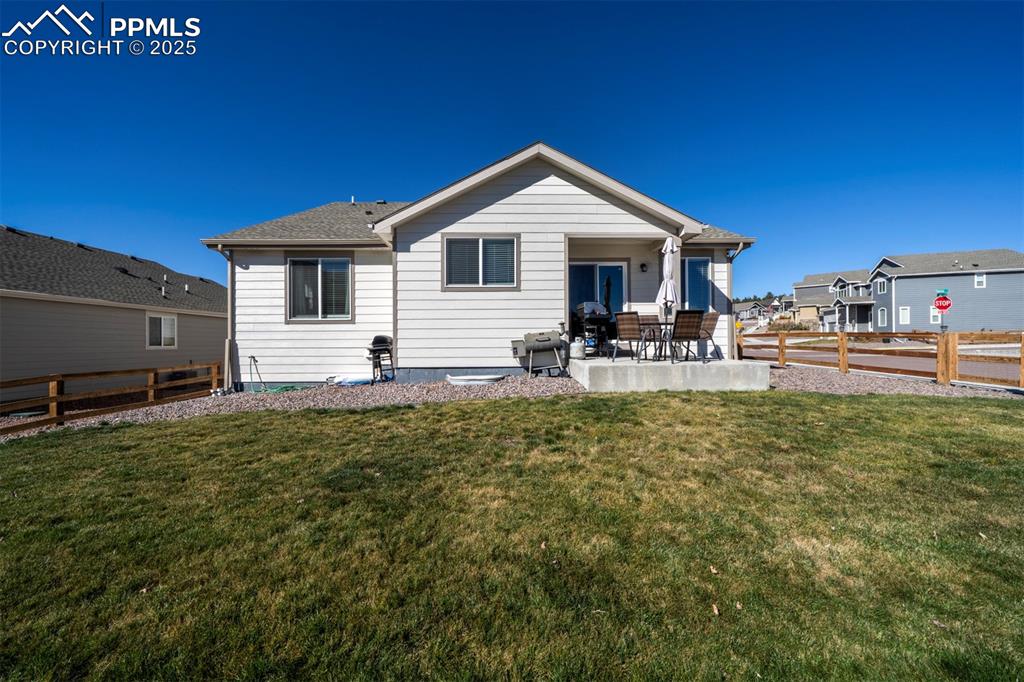 5489 Makalu Drive Colorado Springs, CO 80924 - Photo 6 of 47 a front view of house with yard and seating space