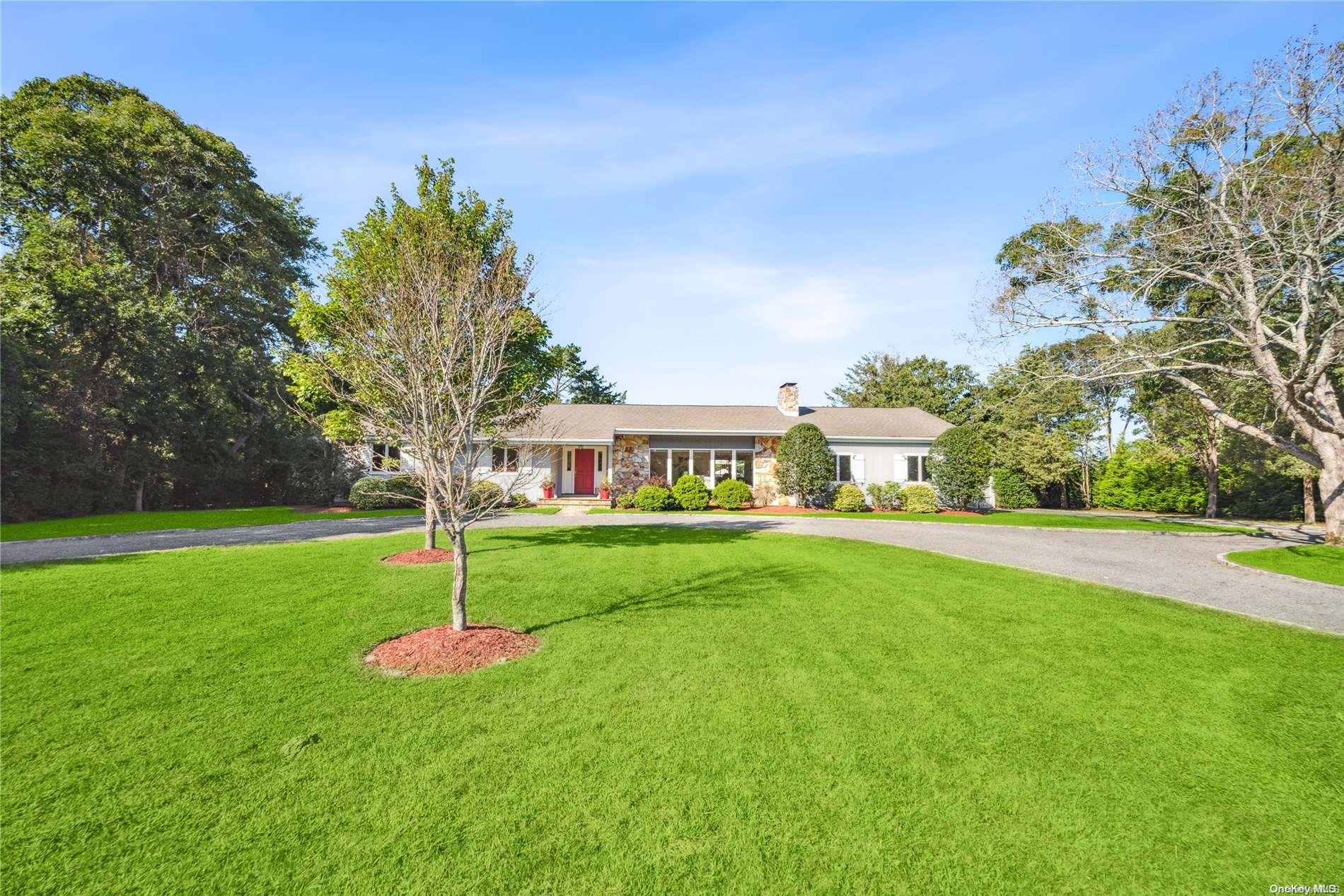 8 Woodcock Lane Remsenburg, NY 11960 - Photo 1 of 1 a view of a house with a yard