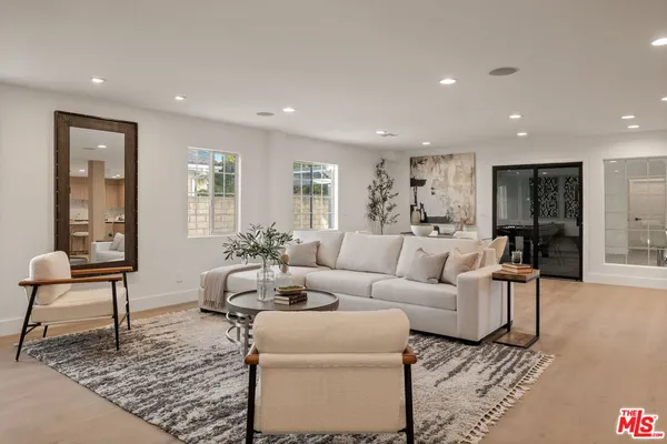 a living room with furniture and a rug