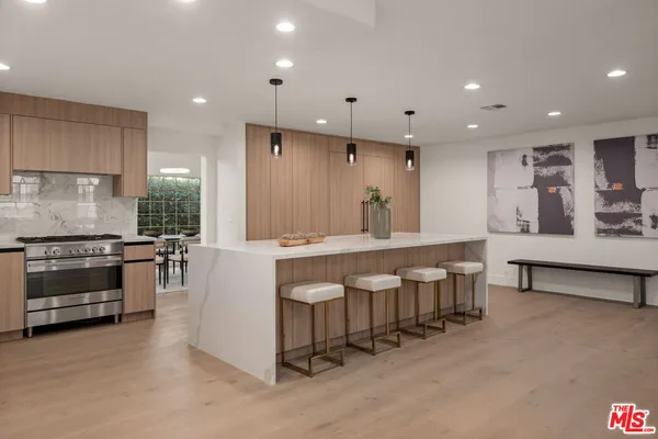 a large kitchen with lots of counter space and a sink