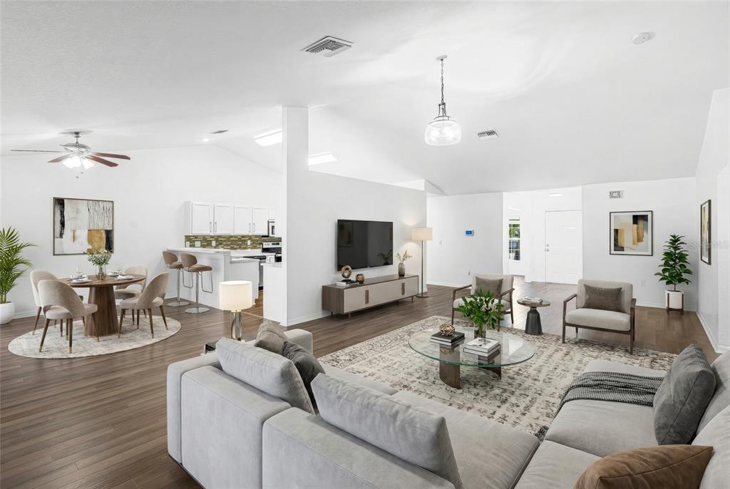 418 Windermere Drive Lehigh Acres, FL 33972 - Photo 11 of 71 a living room with furniture and a flat screen tv