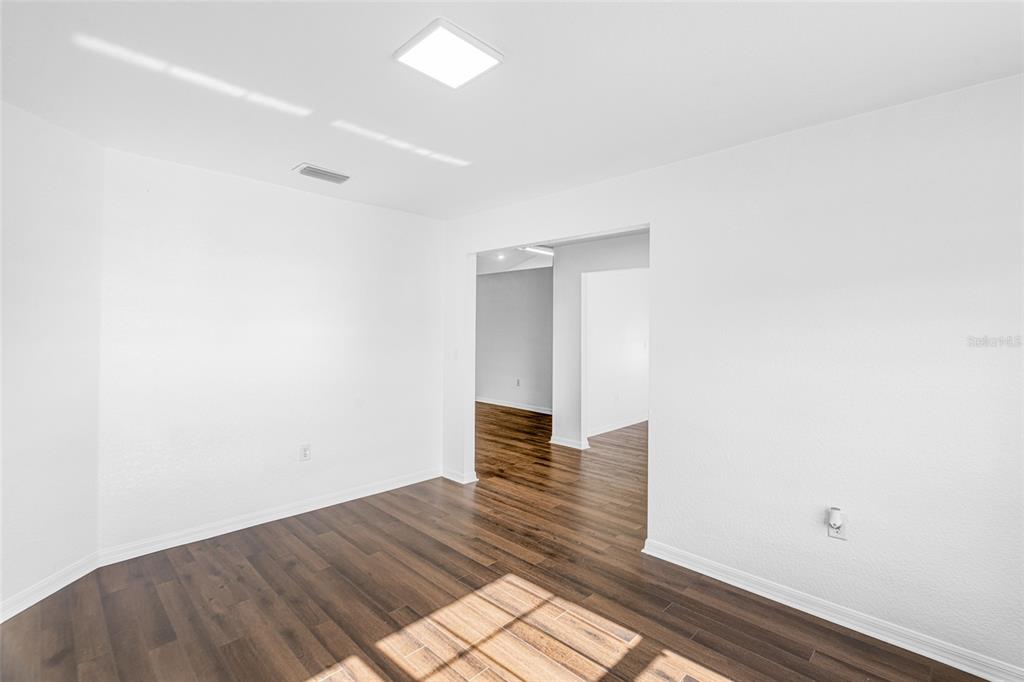 418 Windermere Drive Lehigh Acres, FL 33972 - Photo 15 of 71 a view of hallway with wooden floor