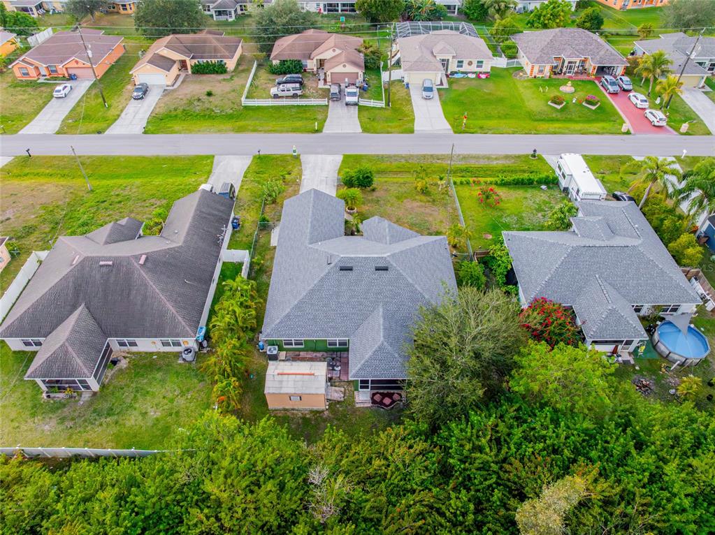 418 Windermere Drive Lehigh Acres, FL 33972 - Photo 56 of 71 an aerial view of multiple houses with yard