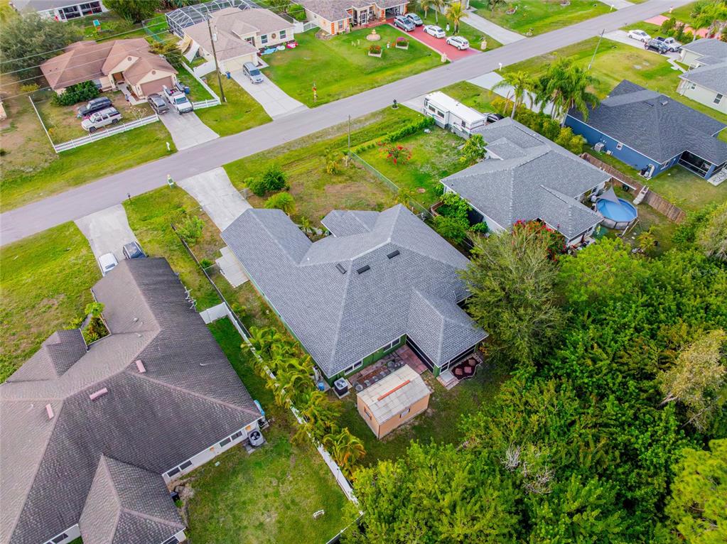 418 Windermere Drive Lehigh Acres, FL 33972 - Photo 57 of 71 an aerial view of a house with a garden