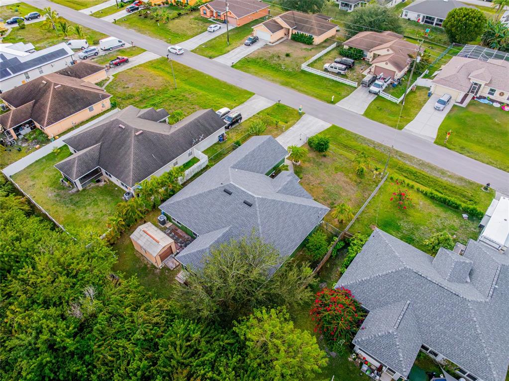 418 Windermere Drive Lehigh Acres, FL 33972 - Photo 58 of 71 an aerial view of a house with a garden
